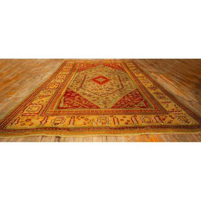 This exceptional Antique Turkish Oushak rug, dating to circa 1890, is a classic example of 19th-century decorative art....
