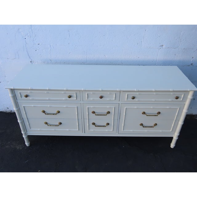 This magnificent Dresser is made of wood, and metal. The Dresser was made by Thomasville, and it is stamped. This...