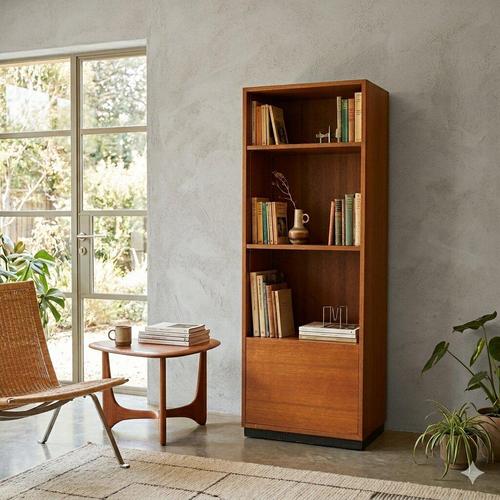 Small bookcase with a drop-down compartment and adjustable shelves. Made of teak veneer. Good condition. This piece is...