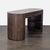 This stylish desk by Four Hands features a smooth, rounded design in rich wood. It includes a large drawer and open side...