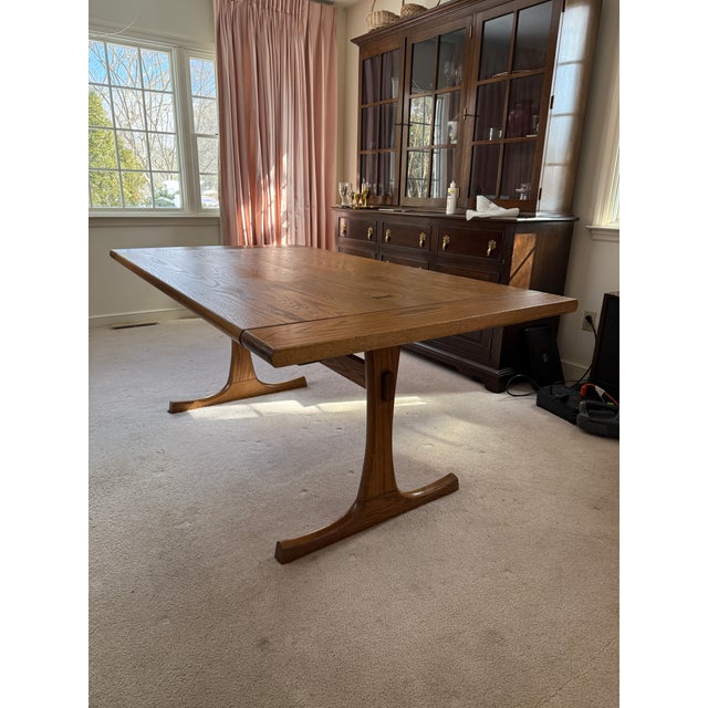 Vintage Conant Ball Solid Oak Extendable Dining Table with Walnut Butterfly Inlays, c. 1950s. The design is attributed to...