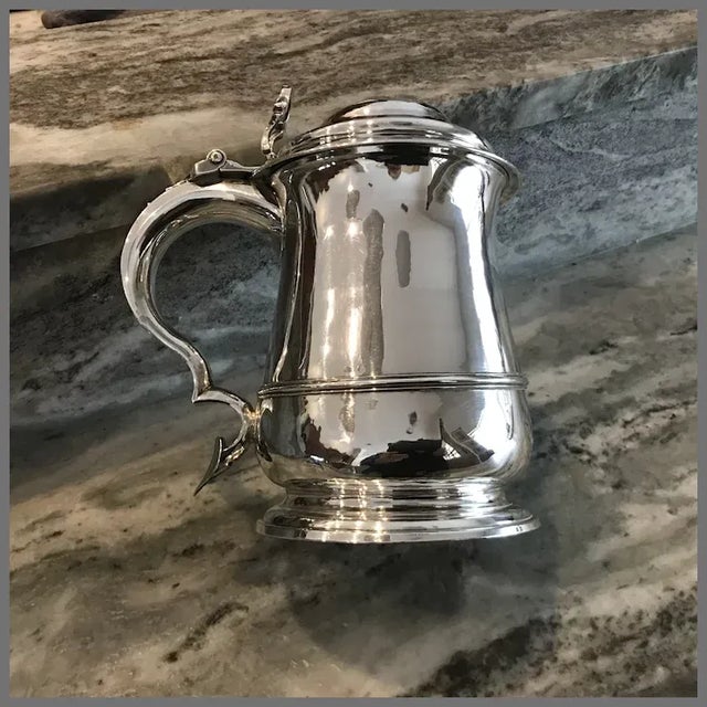 A superb and rare large English sterling tankard dated 1738. Made by London silversmiths Richard Gurney and Thomas Cook....