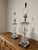 Offering a striking pair of vintage Paul Hanson table lamps featuring sculptural crystal bodies with dramatic swirling...