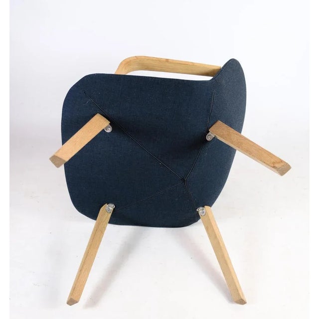 Lounge chair, model ej 3, in oak with blue wool fabric made by erik jørgensen in continuation of the eyes series. The...