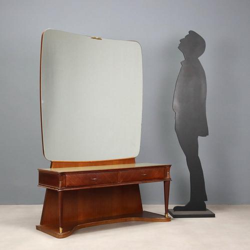 Petineause with double drawer under the top, in mahogany veneer, back-treated glass top, brass profile and details. This...