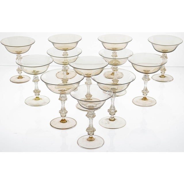This exceptional set of 12 vintage champagne glasses is a rare and unique find. Handmade in murano, italy, by cenedese,...