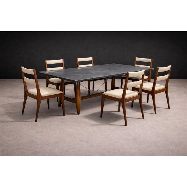 This set of six dining chairs, produced in Brazil in the 1950s, reflects the restrained elegance and structural lightness...