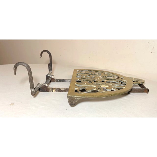 Up for sale is a very rare antique 18th century handmade fireplace hook trivet stand. It features wrought iron attachable...