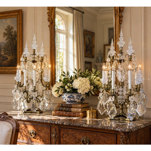 An impressive pair of early 20th-century brass and crystal girandoles, each rising a substantial 33 inches high. Designed...