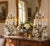 An impressive pair of early 20th-century brass and crystal girandoles, each rising a substantial 33 inches high. Designed...