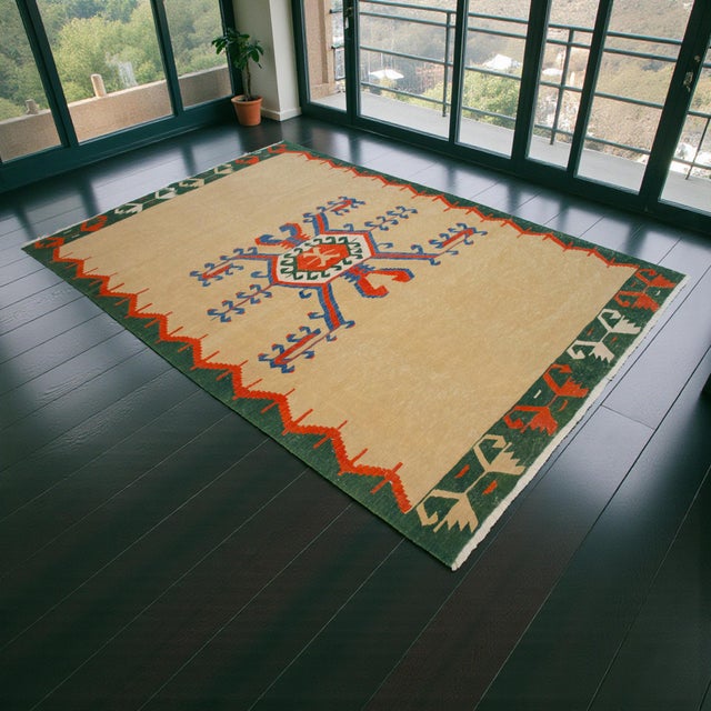 Handwoven in Turkey with timeless geometric artistry, this vintage Oushak kilim brings a serene, minimalist tribal...