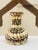 This charming vintage vase has been creatively embellished with an array of natural seashells, giving it a whimsical...