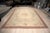 Vintage Aubusson in soft, faded pastels. A bouquet of pink roses sits at the centre of a pale cream field, framed by a...