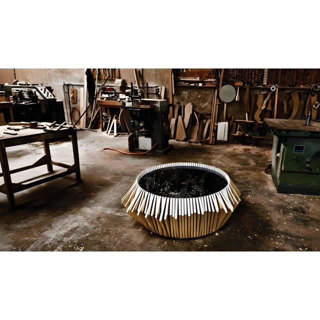 The radiant sun: an exercise in visual choreography radiant as an illusory sun, the utopia 02 coffee table is an...