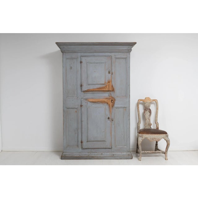 Swedish baroque cabinet in painted redwood made during the mid 1700s. The paint is from the mid 1800s and the cabinet has...