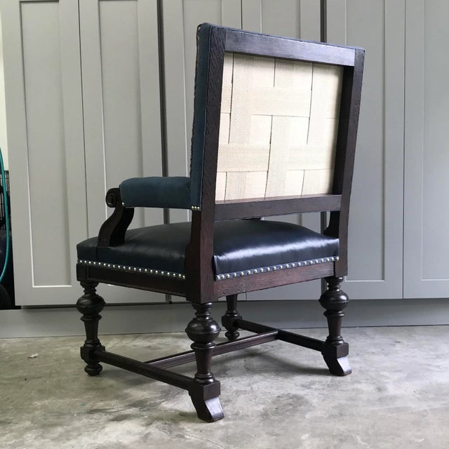 This 100-year old solid oak chair has been revived with an antique, hand woven, Turkish camel saddlebag textile on the...