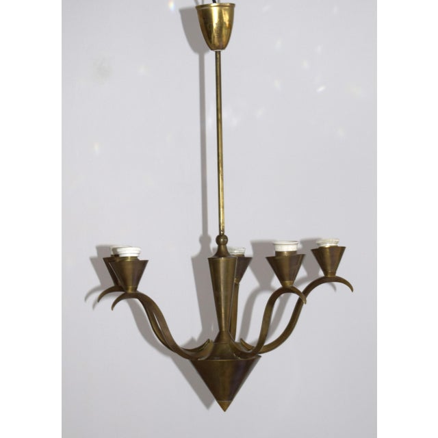 Brass ceiling lamp from the early 1920s. The design is attributed to Dagobert Peche. 5 arms; E27 socket This piece is...