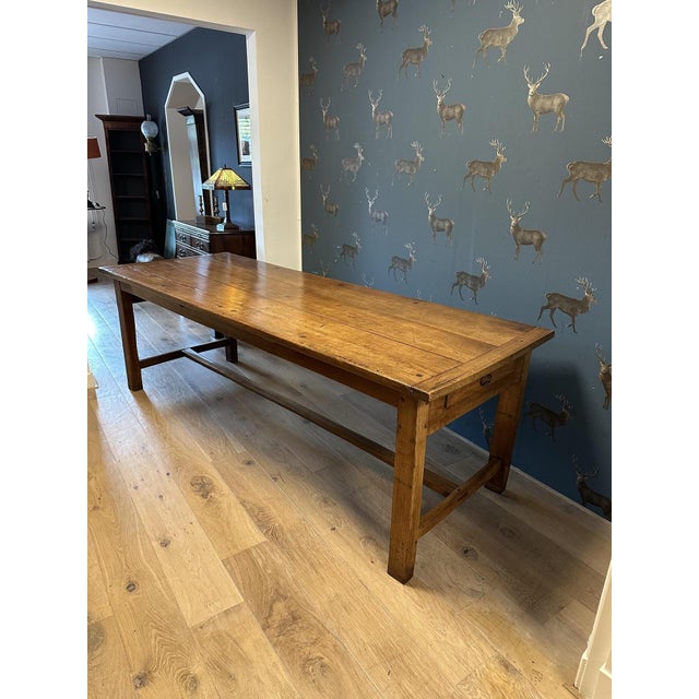 Beautiful vintage French cherry wood table with drawers at the ends. The table possesses that perfect, lived-in look one...