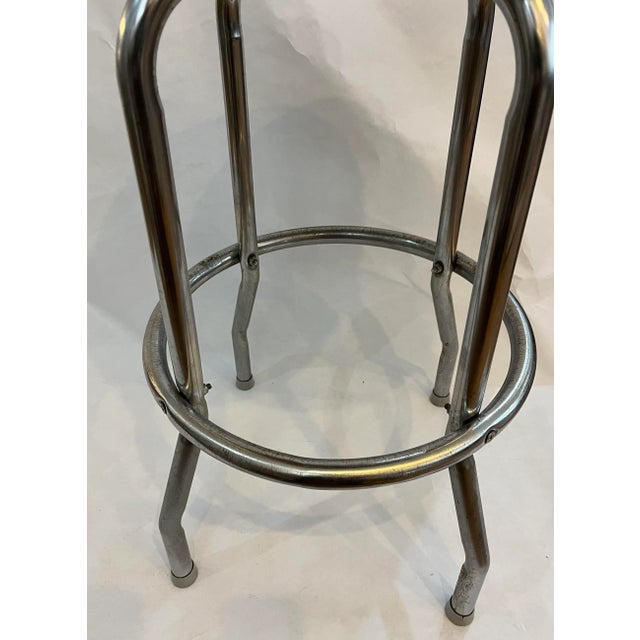 A beautiful vintage black vinyl seat and chrome base bar stool in nice shape overall. A great kitchen or bar accessory.