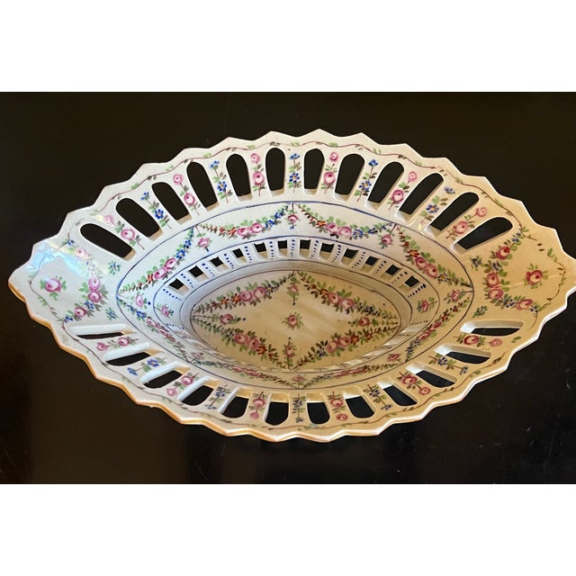 Hand painted reticulated bowl made by Sevres in France around 1900. Stamped on the base.