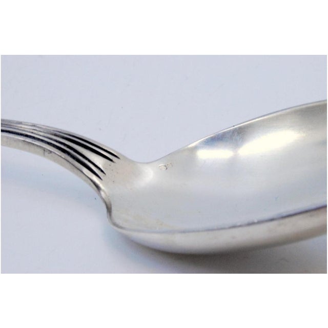 Silver Rice and Serving Spoon with Grooves Along the Handle, in Very Good conditions. Designed 1920 to 1949 This piece has...