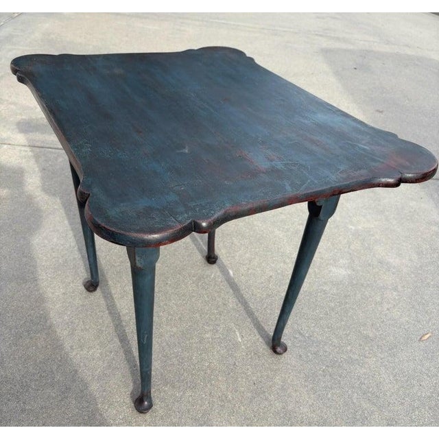 This 18thc original blue over a light grey painted walnut tea table with fine queen Anne legs and all original wood blocks...