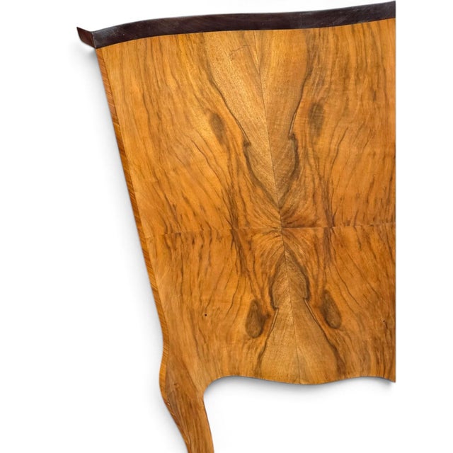 This pair of Italian bookmatched walnut bedside cabinets is a stylish addition to any bedroom. The brown color and...