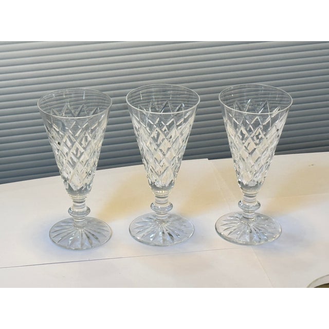 Design Plus gallery presents a Set of Three Crystal Champagne Flutes from Waterford. These glasses offer their most...