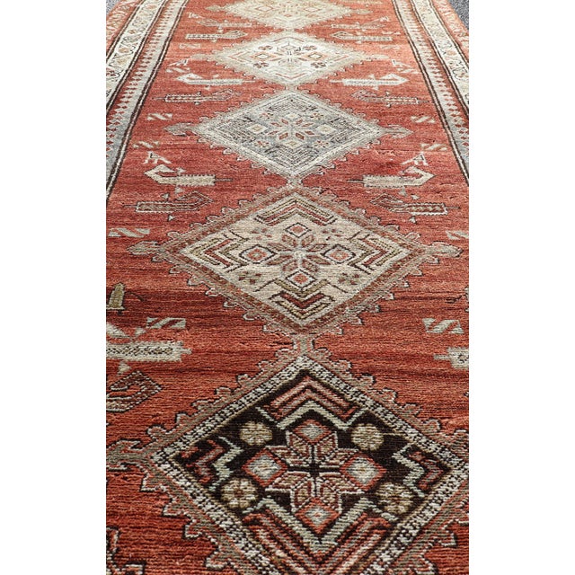 Tribal Antique Kurdish Runner With Rusty Red Background and Medallions Tribal Motifs 3'5 X 10'1 For Sale - Image 3 of 14