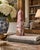 A beautifully proportioned marble obelisk in richly veined shades of red, purple, and brown. The sculptural silhouette and...