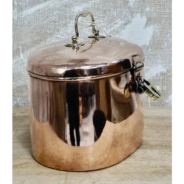 A Very Rare Victorian Copper Hat Tin. Made from copper with a brass carry handle. This Oval shaped hat box has a hinged...