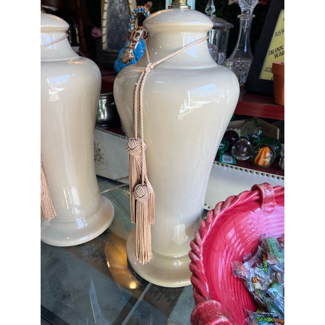 Up for consideration is a beautiful vintage pair of ceramic table lamps with light pink tassels. These would look lovely...