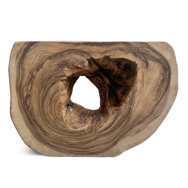 Beautiful organic monkey pod / suar wood side table. Natural freeform shape with center hole that has been sanded smooth...