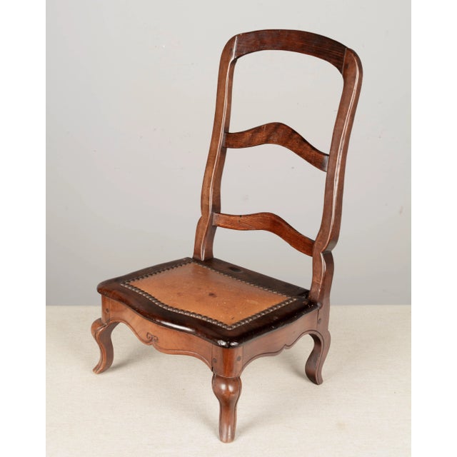 A 19th century Louis XV style Country French mahogany small sampler chair, hand-crafted by the furniture maker as an...