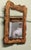 A good bevelled wall mirror with poker work carving of palm leaves. The mirror is in good condition and has its original...
