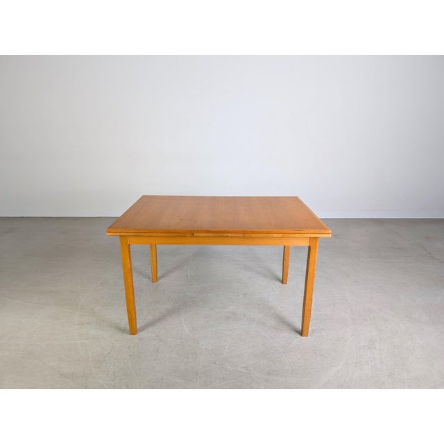 We are offering for sale an extremely rare, extendable vintage dining table from the traditional German manufacturer...