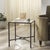 Introducing the Tauri Forged Metal Square Accent Table - a stunning blend of artistic flair and bold, industrial design....
