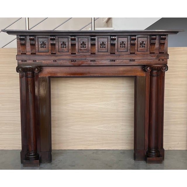 A handsome antique Edwardian style oak fire mantel dating from the early 20th century. This fire surround is substantially...