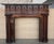 A handsome antique Edwardian style oak fire mantel dating from the early 20th century. This fire surround is substantially...