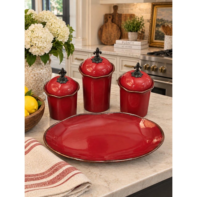 A striking four-piece collection from Southern Living’s “Cinnabar” collection, featuring a rich, glossy cinnabar-red...