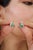 These elegant 1.85 carat emerald and diamond stud earrings are crafted in 925 sterling silver and feature a graceful leaf-...