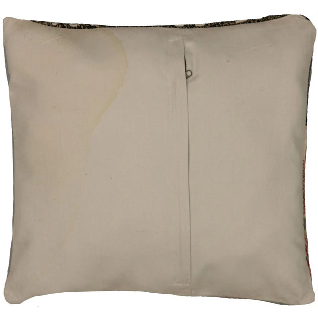 This pillow is made with a vintage handwoven Turkish kilim fragment. It has a cotton back and a zipper closure. Please...