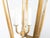 A Midcentury Continental Art Nouveau style gilt metal lantern with three lights. Immerse your space in the classic...