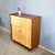 A striking highboard in typical 1960s design, featuring a beautiful contrast between the darker body and light fronts. The...
