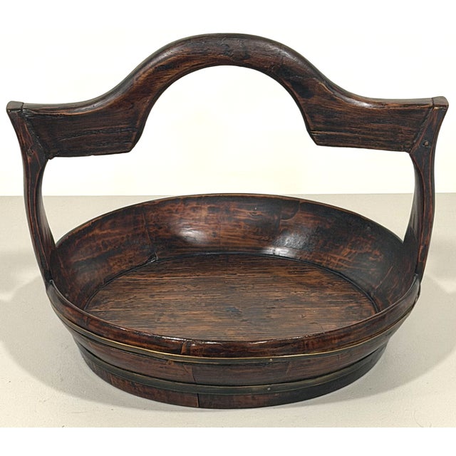 This basket or tray is likely from the mid 19th century or earlier and was imported from China. Similar baskets have been...