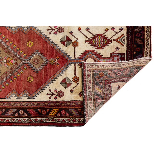 Elevate your interiors with this exceptional vintage Caucasian Kazak wool runner rug, featuring striking geometric...