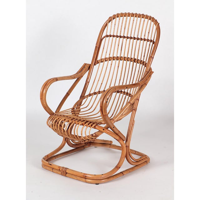 Pair of Italian Mid-Century Modern Rattan Lounge Arm Chairs. Dimensions: Height: 40″ x Width: 25.5″ x Depth: 30″ Seat...