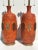 Pair of orange lava glazed ceramic lamps in the style of Marbro. Shades are not included. Offered at Gallery Girasole in...