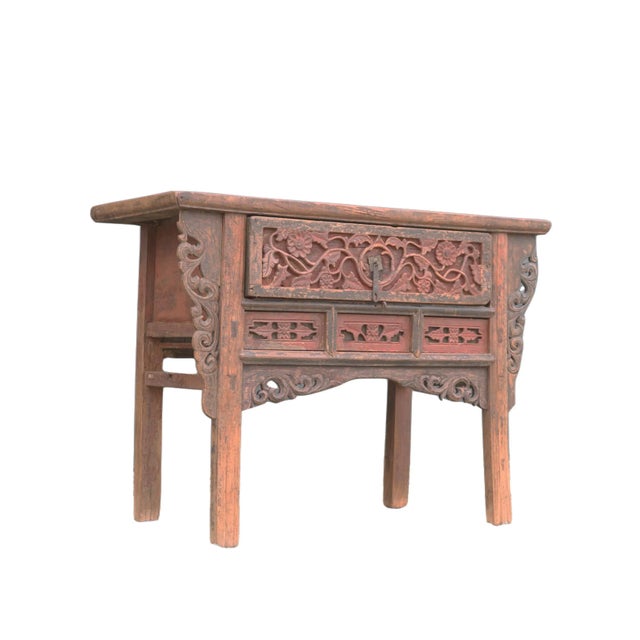 This early 19 century antique Chinese 1 large drawers chest showcases exquisite hand carved drawer fronts and sides. Aged...