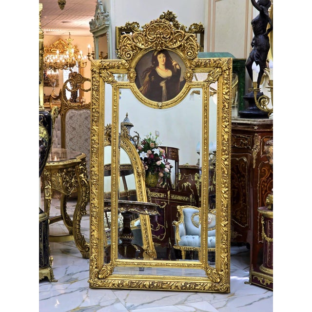 Add timeless European elegance to your interior with this ornate vintage-style wall mirror, featuring an intricately...